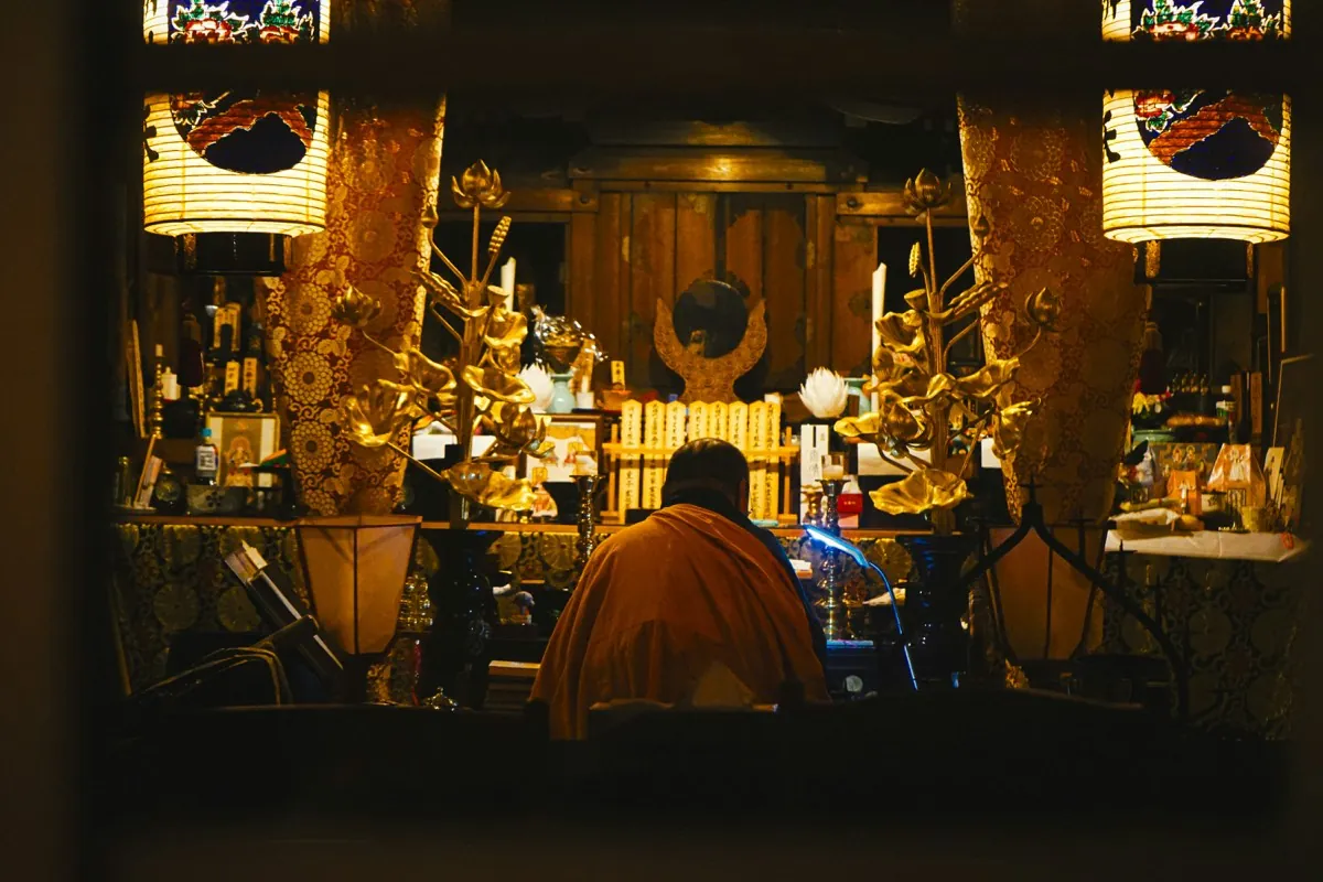 Elderly man working at night at a stall in the Omicho Market of Kanazawa