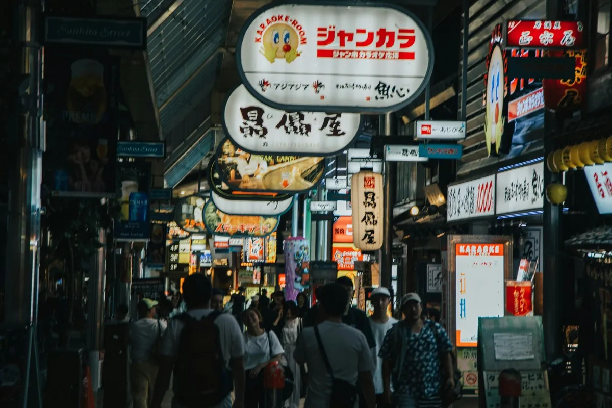 Sankita-dori shopping arcade next to Sannomiya in Kobe, with illuminated signs and people