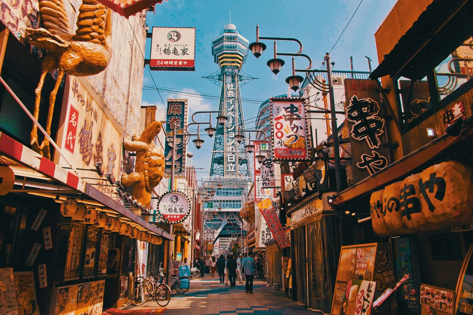 Dotonbori at night with its neon lights reflected in the Osaka canal