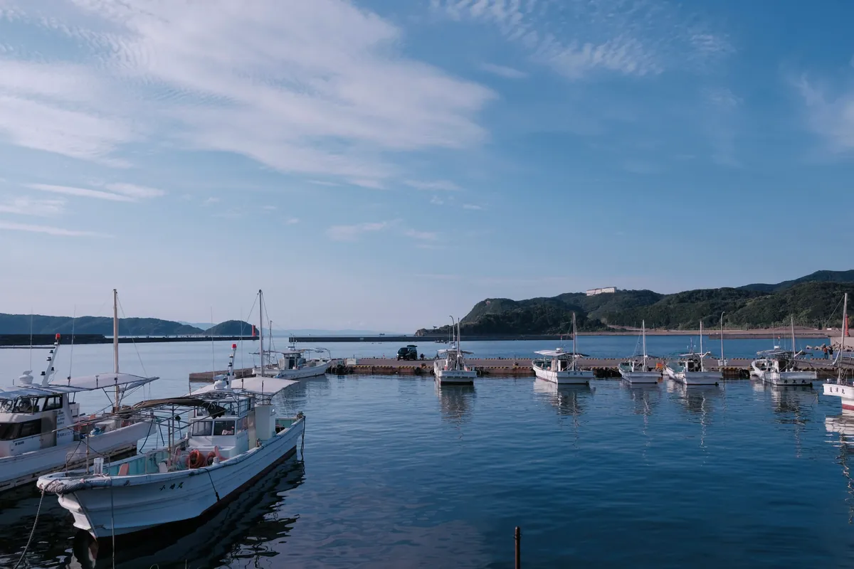 Fishing port with moored boats and a calm sea on the Wakayama coast
